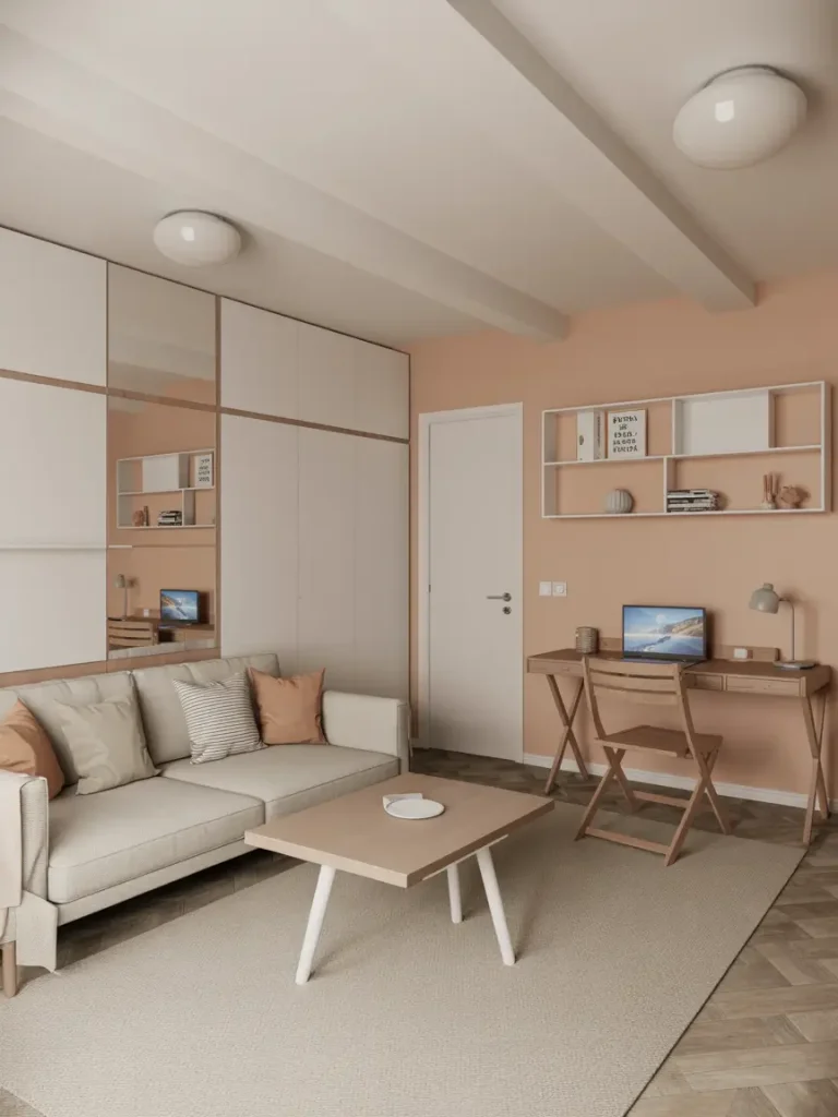 Small basement design featuring a cozy sofa, light wood coffee table, compact desk with laptop, and minimalist shelving against peach-toned walls.