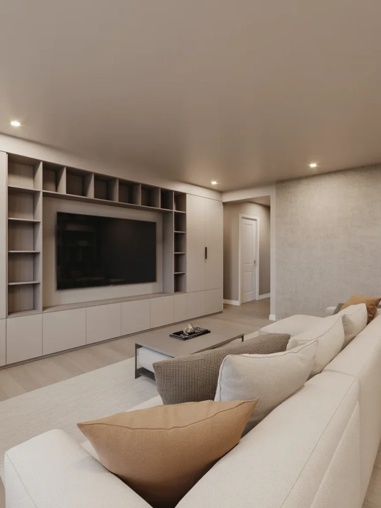 Modern basement TV wall with built-in shelving and neutral sectional sofa