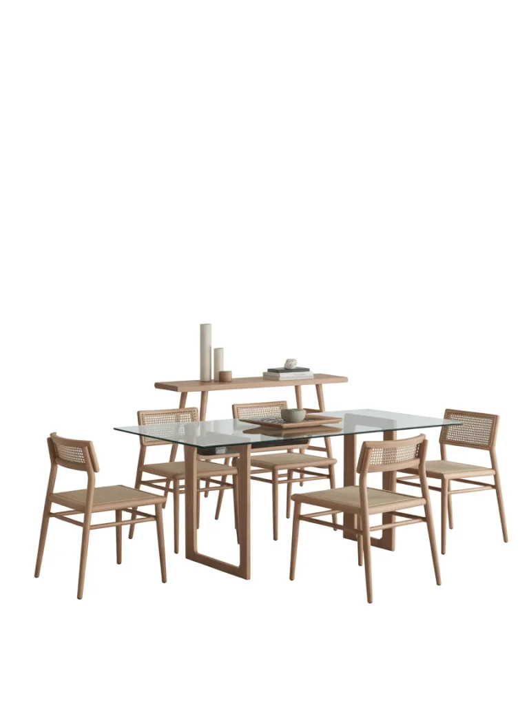 Glass dining table with slim wooden chairs and airy minimalist design.